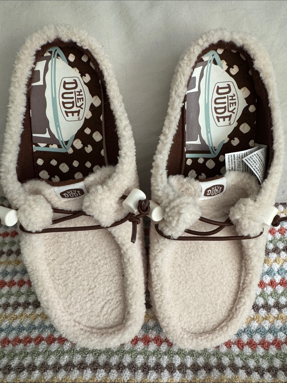 Hey Dude women’s Cream Sherpa Moccasin Slippers with Brown Trim